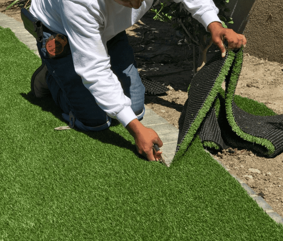 turf being trimmed for installation 